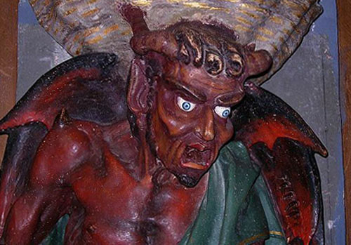 The demon Asmodeus supporting the holy water stoup at Rennes-le-Château